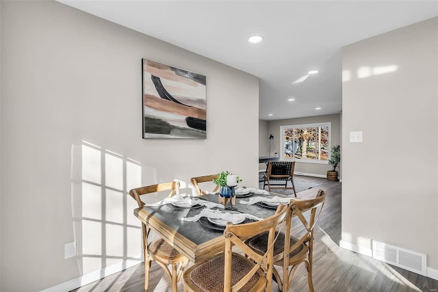 dining room with hardwood / wood-style floors