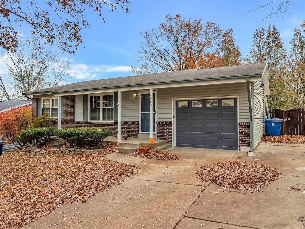 single story home featuring a garage