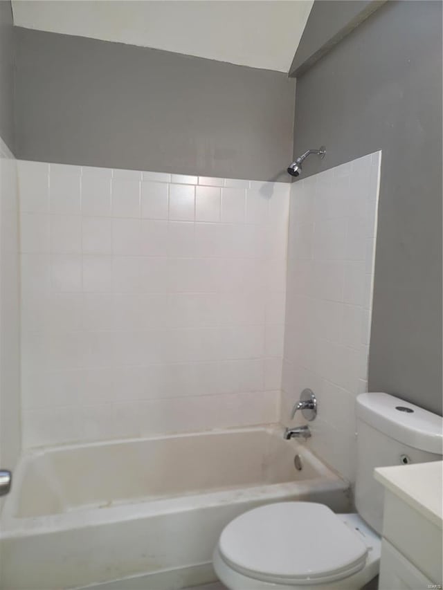 full bathroom featuring vanity, toilet, and tiled shower / bath