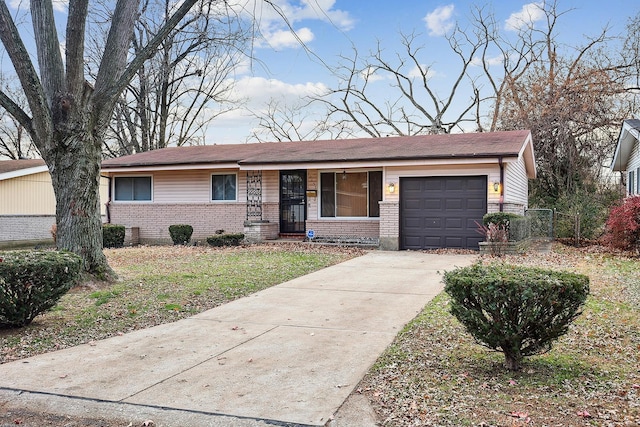 ranch-style house with a garage and a front lawn