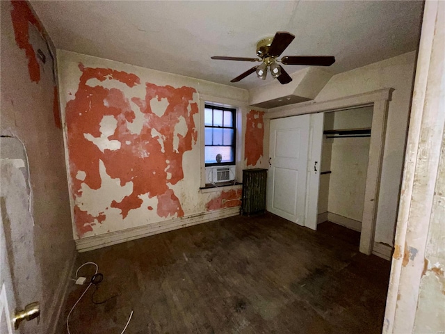 unfurnished bedroom with ceiling fan, a closet, cooling unit, and dark hardwood / wood-style floors