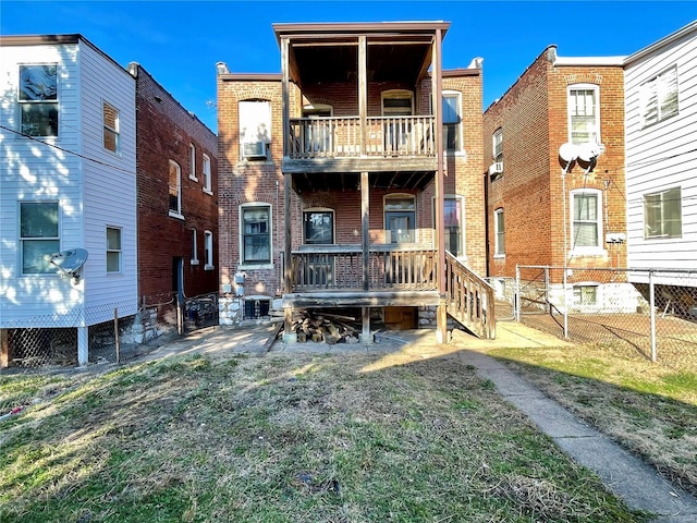 back of house featuring a balcony and cooling unit