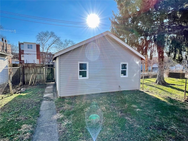 view of home's exterior with a yard