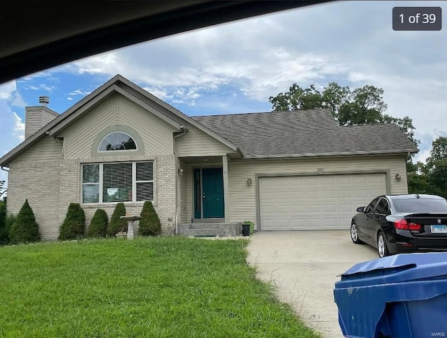 ranch-style home with a garage and a front lawn