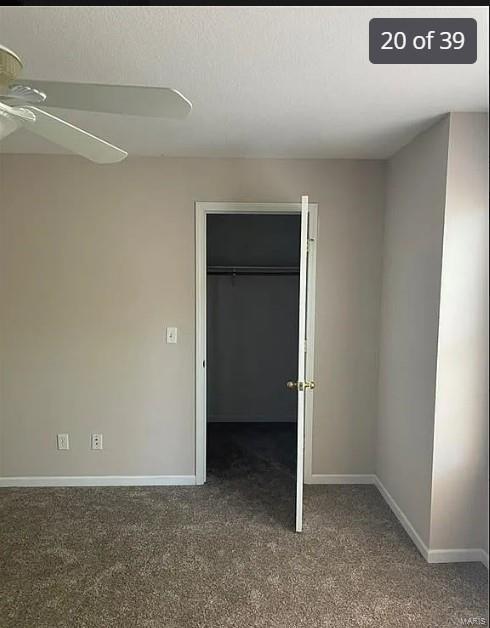 unfurnished bedroom featuring carpet flooring, a closet, and ceiling fan