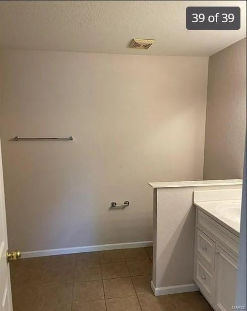 laundry room featuring tile patterned floors