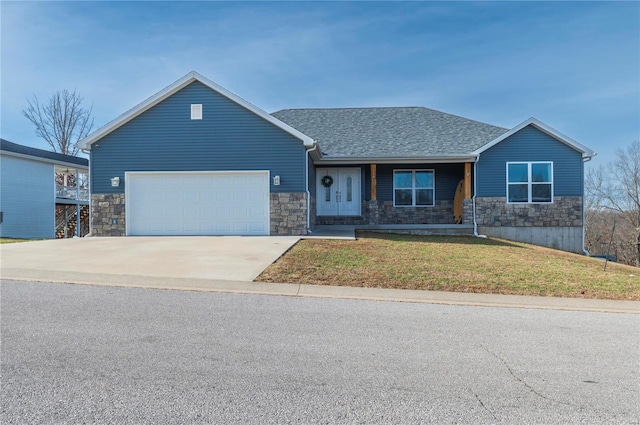 view of front facade with a garage and a front yard