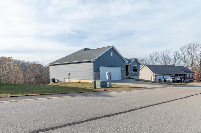 view of side of home with a garage