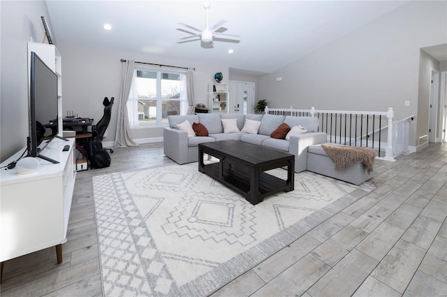 living room with ceiling fan and light hardwood / wood-style floors