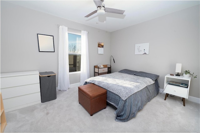 bedroom featuring ceiling fan and light colored carpet