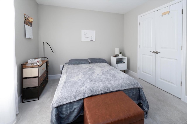 carpeted bedroom featuring a closet