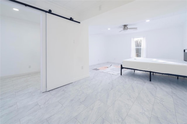 unfurnished bedroom with a barn door