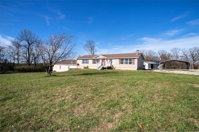 ranch-style home with a front lawn and a carport