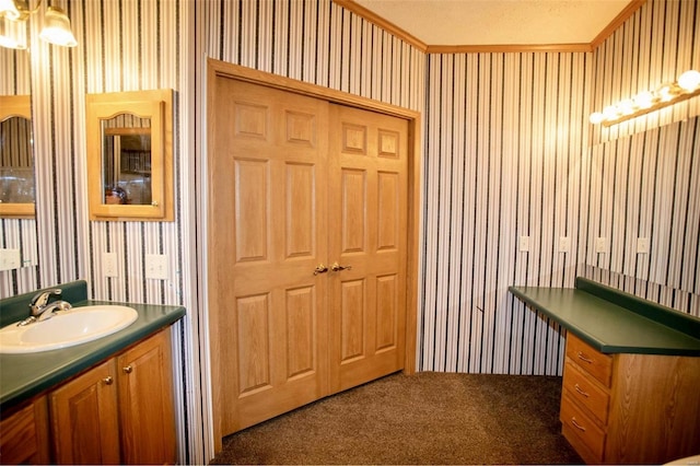 bathroom with vanity and a textured ceiling