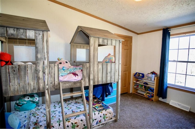 carpeted bedroom featuring crown molding, a textured ceiling, and vaulted ceiling