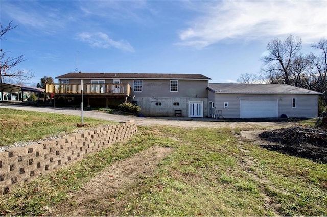 view of front facade featuring a garage and a deck