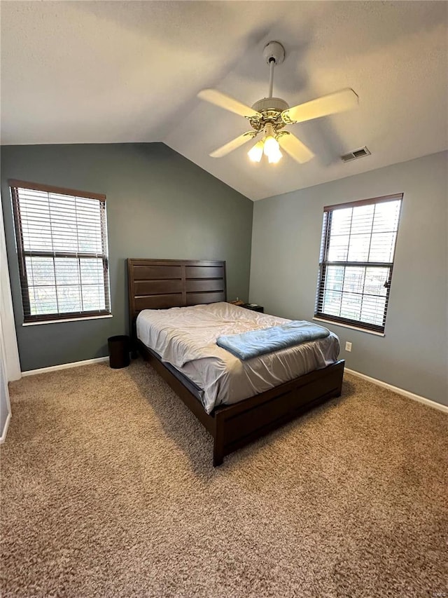 bedroom featuring ceiling fan, carpet, and vaulted ceiling