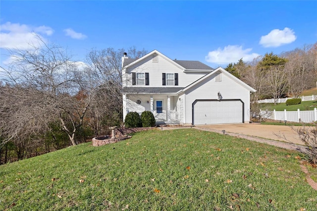 view of property with a garage and a front lawn