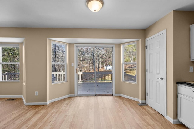 interior space with light hardwood / wood-style floors