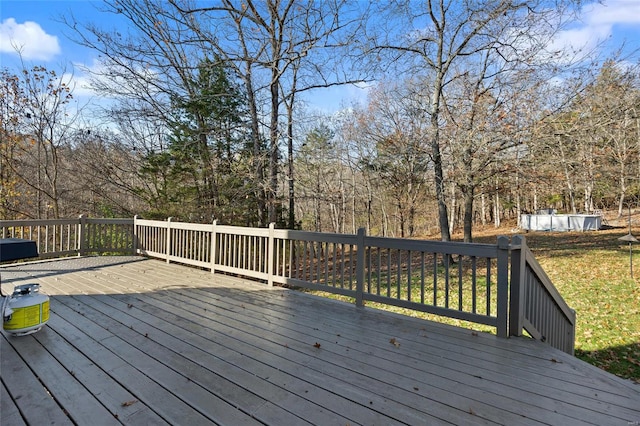 deck featuring a swimming pool