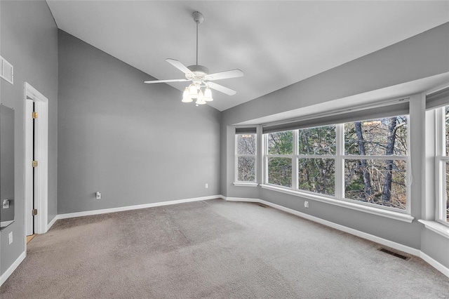 unfurnished room with carpet flooring, ceiling fan, and vaulted ceiling