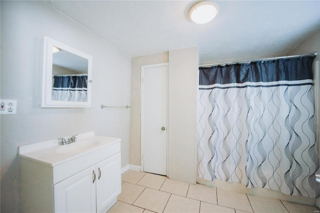 bathroom with tile patterned flooring and vanity