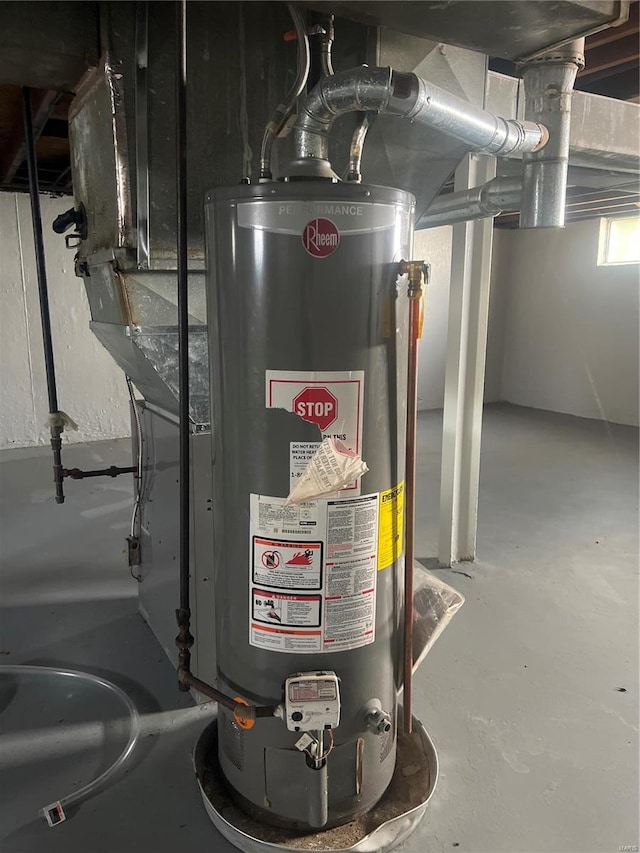 utility room featuring gas water heater