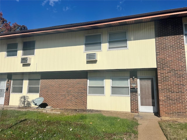 view of property featuring a wall mounted AC