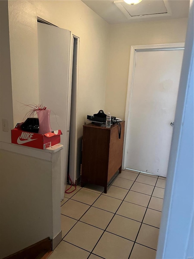 washroom with light tile patterned floors