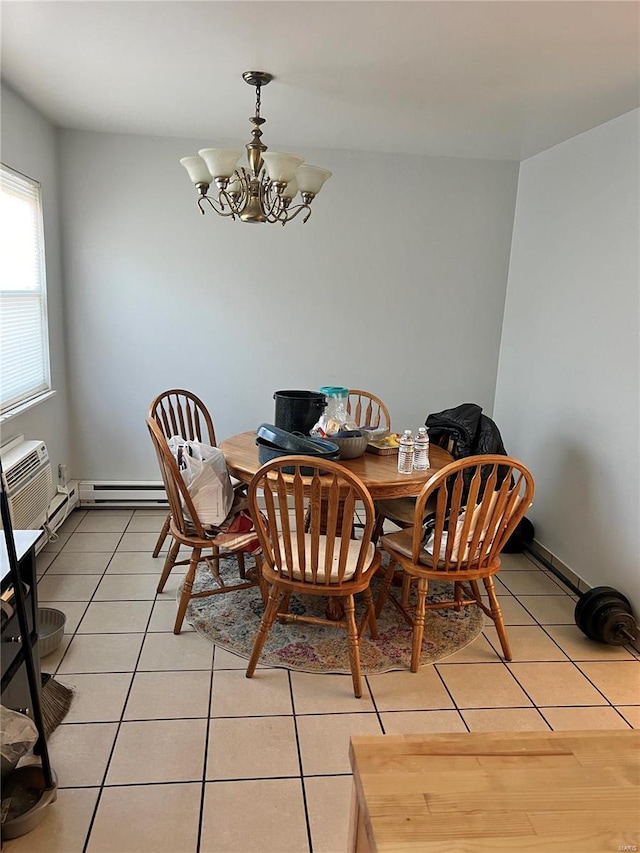 dining room with light tile patterned floors, a wall unit AC, and a notable chandelier