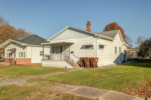 back of house with a yard