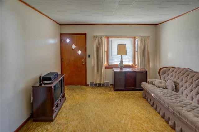 sitting room featuring crown molding and light carpet