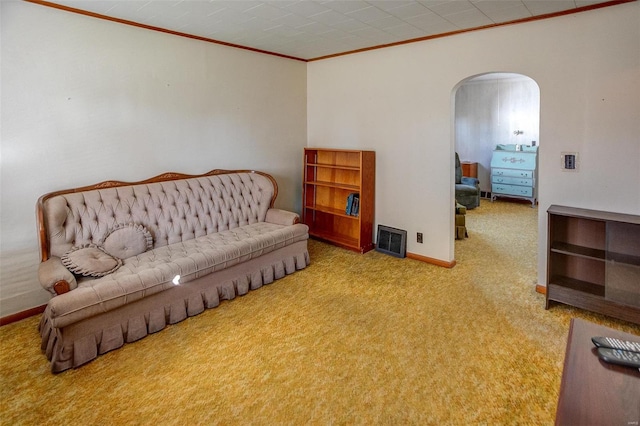 living area with carpet flooring and crown molding