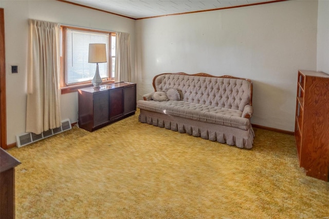 living area featuring crown molding and carpet floors