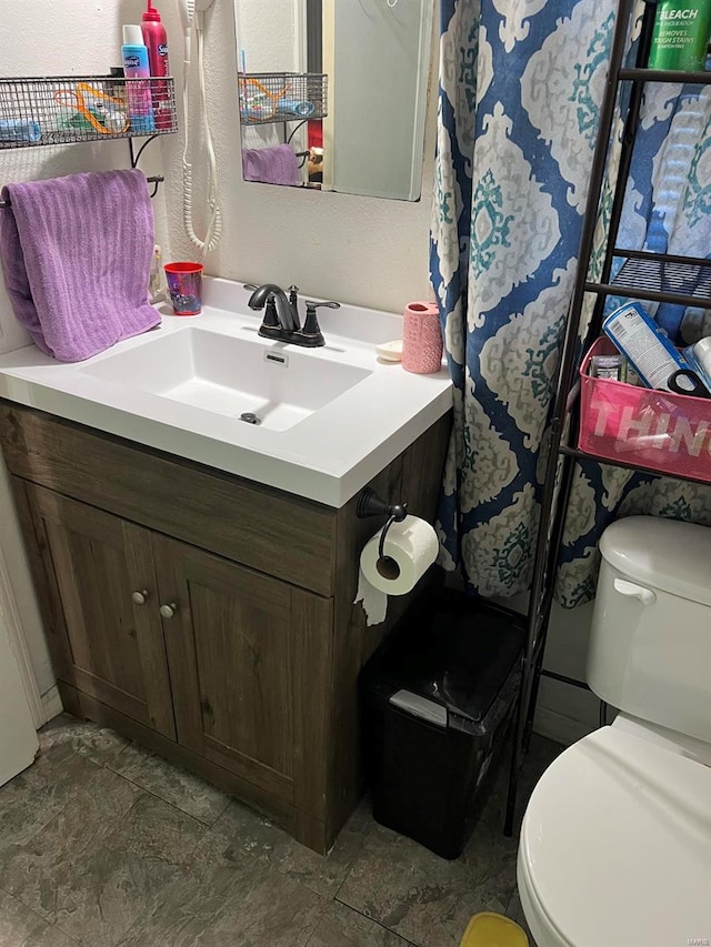 bathroom with vanity and toilet