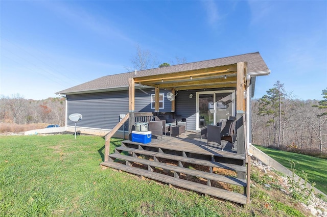 rear view of property with an outdoor living space, a yard, and a deck