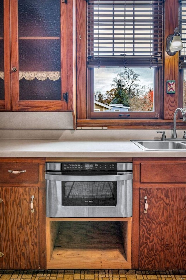 kitchen featuring stainless steel oven and sink