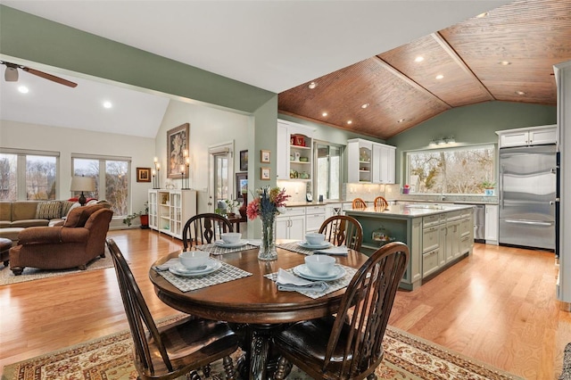 dining area with light wood finished floors, lofted ceiling, recessed lighting, ceiling fan, and wooden ceiling