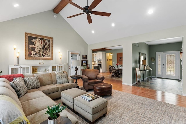 living area featuring high vaulted ceiling, beamed ceiling, wood finished floors, and recessed lighting