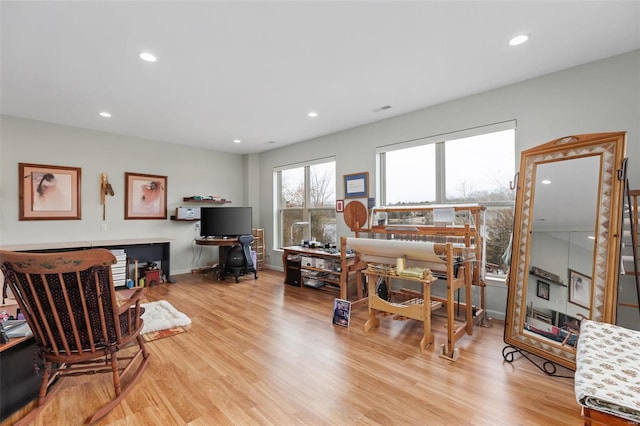 home office featuring baseboards, wood finished floors, and recessed lighting