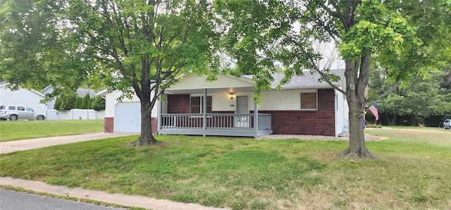 view of front of home with a porch, a garage, and a front yard