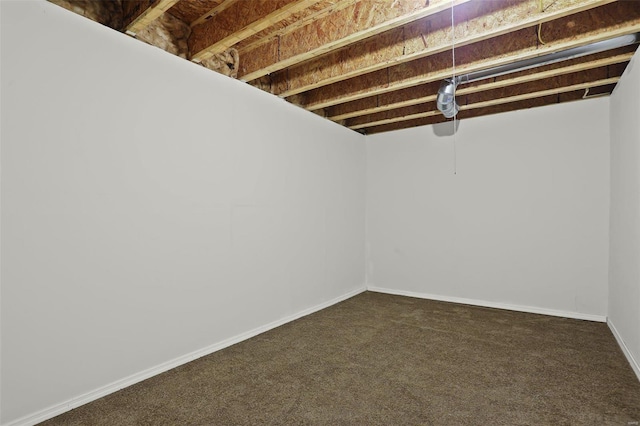 basement with dark colored carpet