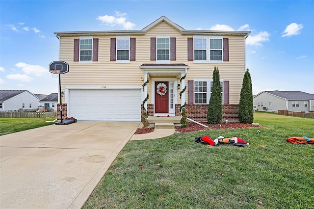 view of front of house featuring a front yard and a garage