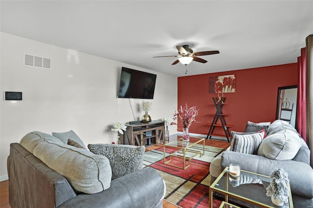 living room with ceiling fan and wood-type flooring