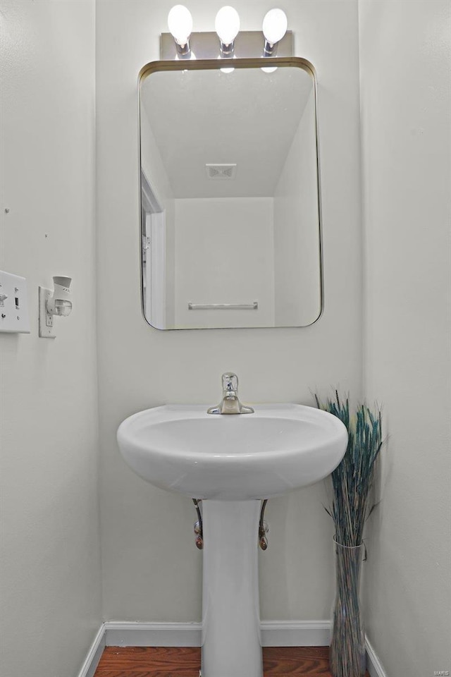 bathroom featuring hardwood / wood-style floors and sink