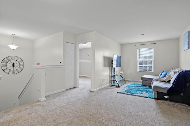 sitting room featuring light carpet