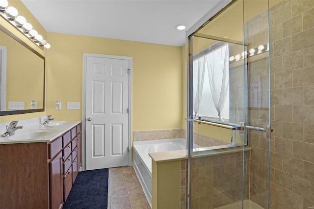 bathroom with independent shower and bath, tile patterned flooring, and a healthy amount of sunlight