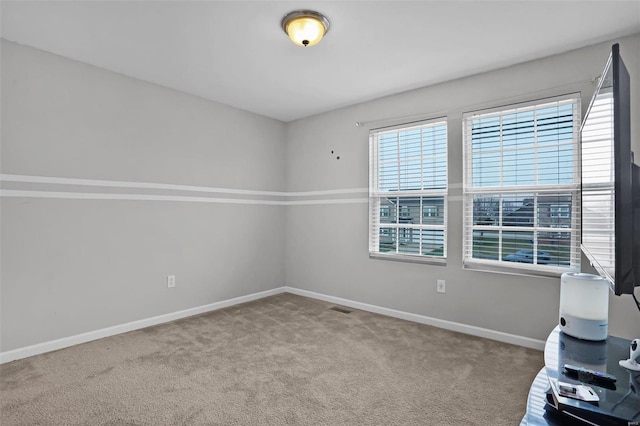 empty room with carpet flooring