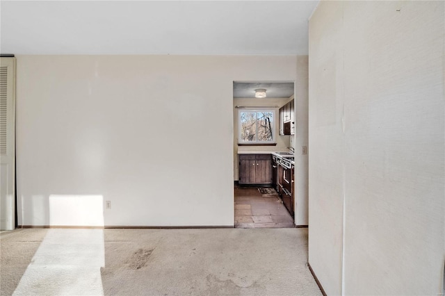 corridor with light colored carpet