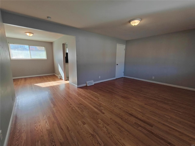 spare room featuring hardwood / wood-style floors